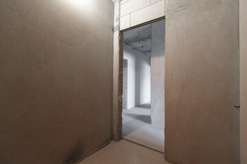 interior of the apartment without decoration in gray colors. rough finish