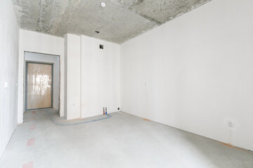 interior of the apartment without decoration in gray colors. rough finish