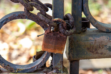 rusty chain and padlock on gate