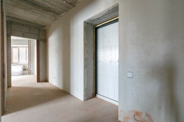 interior of the apartment without decoration in gray colors. rough finish