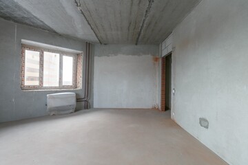 interior of the apartment without decoration in gray colors. rough finish