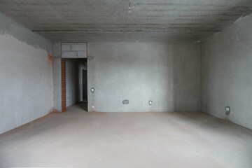 interior of the apartment without decoration in gray colors. rough finish