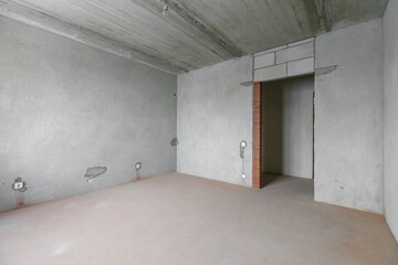 interior of the apartment without decoration in gray colors. rough finish