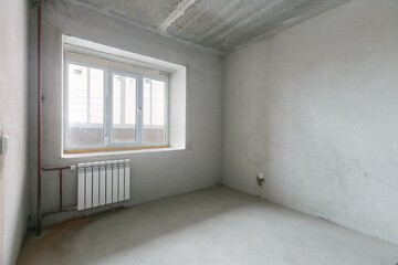 interior of the apartment without decoration in gray colors. rough finish