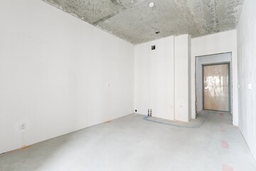 interior of the apartment without decoration in gray colors. rough finish