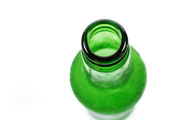 frozen green beer bottle on a white background, close-up
