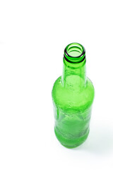 frozen green beer bottle on a white background, vertical photo
