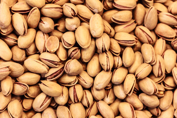 Pistachios texture and background . A lot of tasty pistachios nuts . flat lay, stock photo
