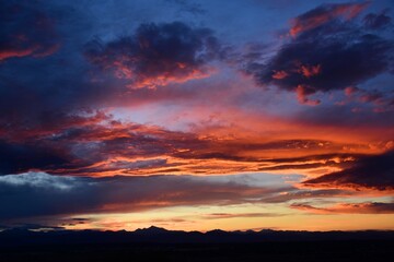 Fototapeta na wymiar spectacular sunset over long's peak and the front range of the colorado rocky mountains as seen form broomfield, colorado