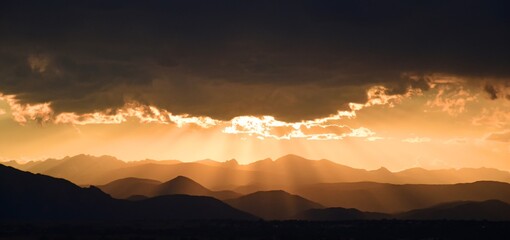 spectacular golden sunset over long's peak and the front range of the colorado rocky mountains as...