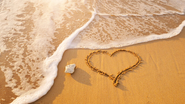 Heart symbol on sea shore beach.