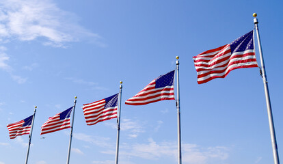 US flags around the Washington Monument in Washington D.C.