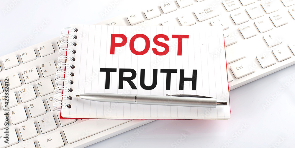 Poster text post truth on keyboard on the white background