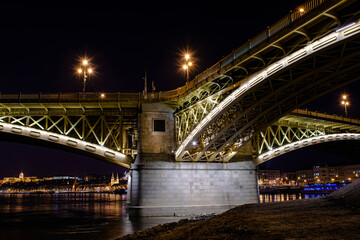 Fototapeta na wymiar Night Budapest, Margit Bridge over the Danube River, reflection of night lights on the water