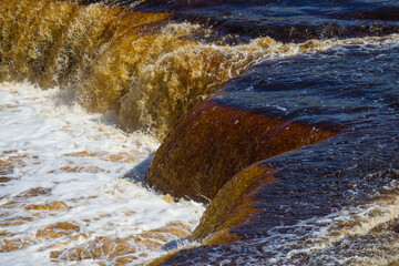 Middle of Tosno (Gertovsky) waterfall close-up on a sunny day. Leningrad region, Russia