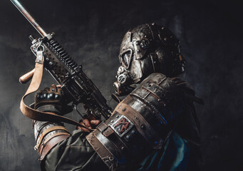 Survivor with custom armour and gun in dark background