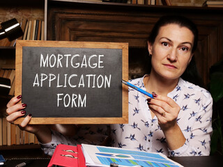 Business concept meaning MORTGAGE APPLICATION FORM with phrase on the chalkboard
