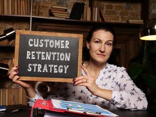 Business concept meaning CUSTOMER RETENTION STRATEGY with sign on the board