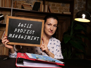 Financial concept about AGILE PROJECT MANAGEMENT with inscription on the chalkboard
