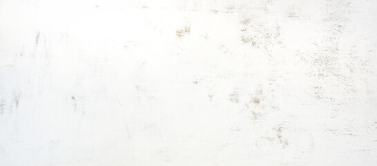 塗りムラを残した白いコンクリートの壁の背景テクスチャー
