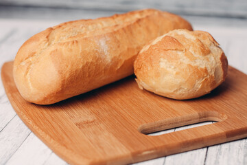 loaf with bun fresh baked goods home cooking wood board fresh flavor