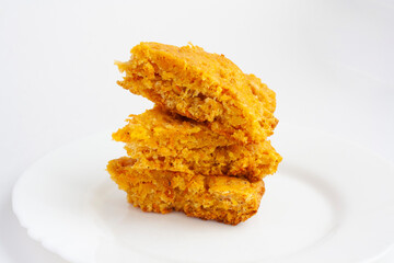 Vegan pastries, carrot cake on a plate on a white background