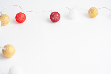 Christmas garland of balloons on a white background, copy space