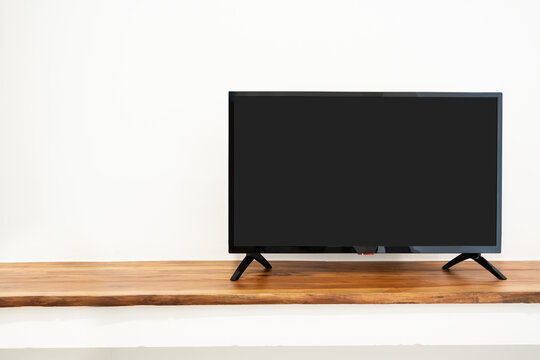 Blank Television Screen On Cupboard Isolated On White Background. TV Template With Copy Space.