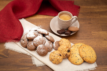 Shortbread and oatmeal cookies of different types: with chocolate, jam, sesame seeds, oatmeal. Assorted cookies on a light background, side view