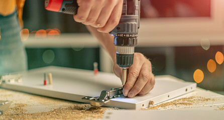 Man working during process of furniture manufacturing