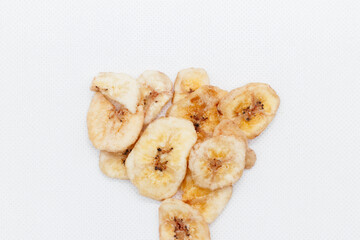 banana chips on white background close up