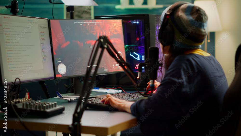 Poster streamer playing fps videogames and talking with team mates on streaming open chat using professiona