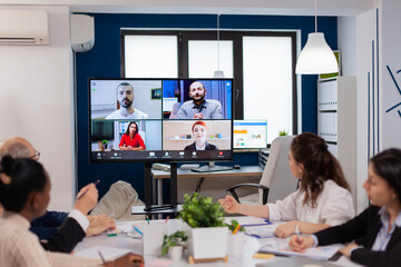Team working by group video call share ideas brainstorming negotiating use video conference....