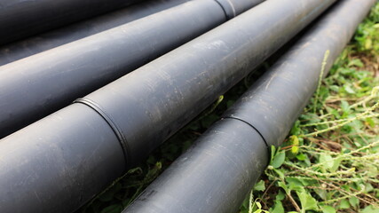Welded joints on HDPE pipes. Polyethylene pipe piles with welded pipe connections raised on the...