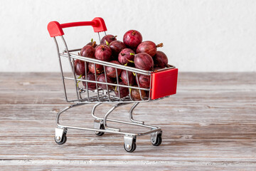 Ripe gooseberries in a shopping cart. Growing and selling gooseberries