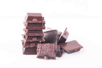 Broken dark chocolate broken stack isolated on white background