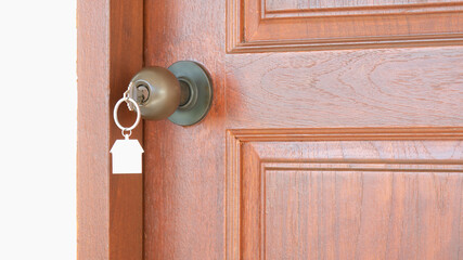 key with metal house symbol to open the door