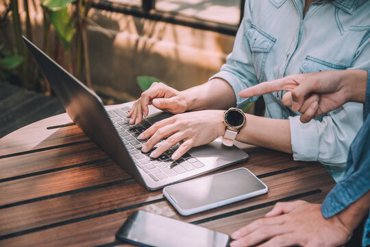 People Use Computer Notebook Work Freelance In Cafe, Man Explain Women On Computer