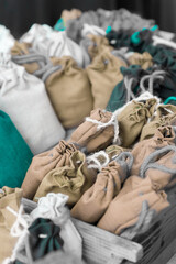 brown and white jute bag, assorted for storage of medicinal and aromatic herbs