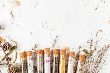 Flat lay of bath salts set in glass tubes