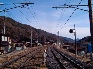 Fototapeta premium Railway tracks and blue sky in the countryside, Japan.