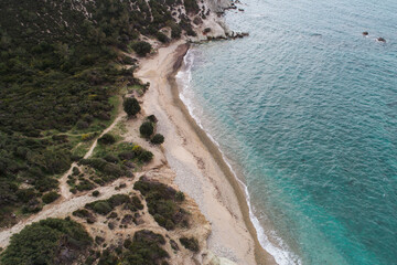 Fototapeta na wymiar Top view aerial image from drone of an stunning beautiful sea landscape beach with turquoise water. Beautiful Sand beach with turquoise water,aerial drone shot. 'Foca' Izmir Turkey