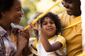  Parents and daughter enjoying lovely time outdoor.