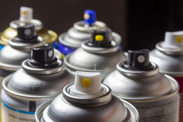 spray cans for paint or lamination to protect photographs or paintings