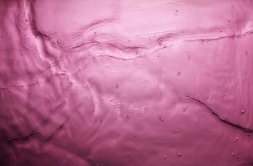 texture of splashing water on pink background