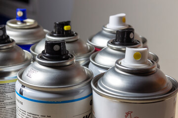 spray cans for paint or lamination to protect photographs or paintings