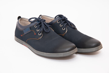 Baby black shoes on a white background