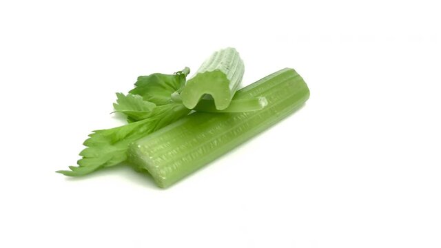 sliced celery sticks isolated on white background