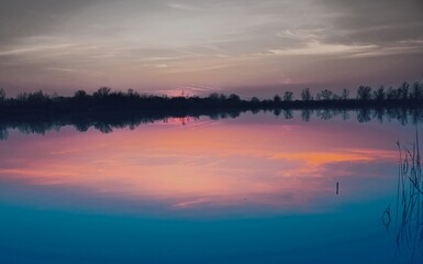 Natural gravel lake. Photographed at sunset.