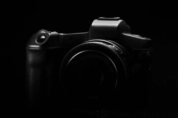 dslr photo camera body silhouette on black background